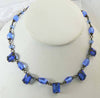 Art Deco blue step glass, brilliant cut glass and brass necklace - Vintage Lane Jewelry