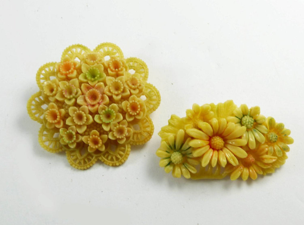 Celluloid Occupied Japan Carved Flower Brooch Pair