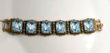 Vintage Florenza Aquamarine Glass Stones Ornate Brass Bracelet - Vintage Lane Jewelry